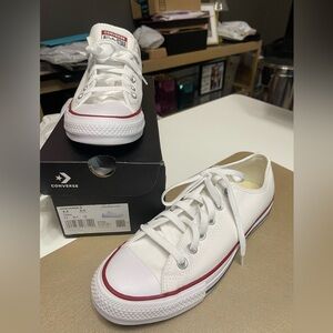 Converse low tops in white, new and never worn, Women’s size 8.5.